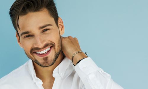 man smiling after getting braces in bondi